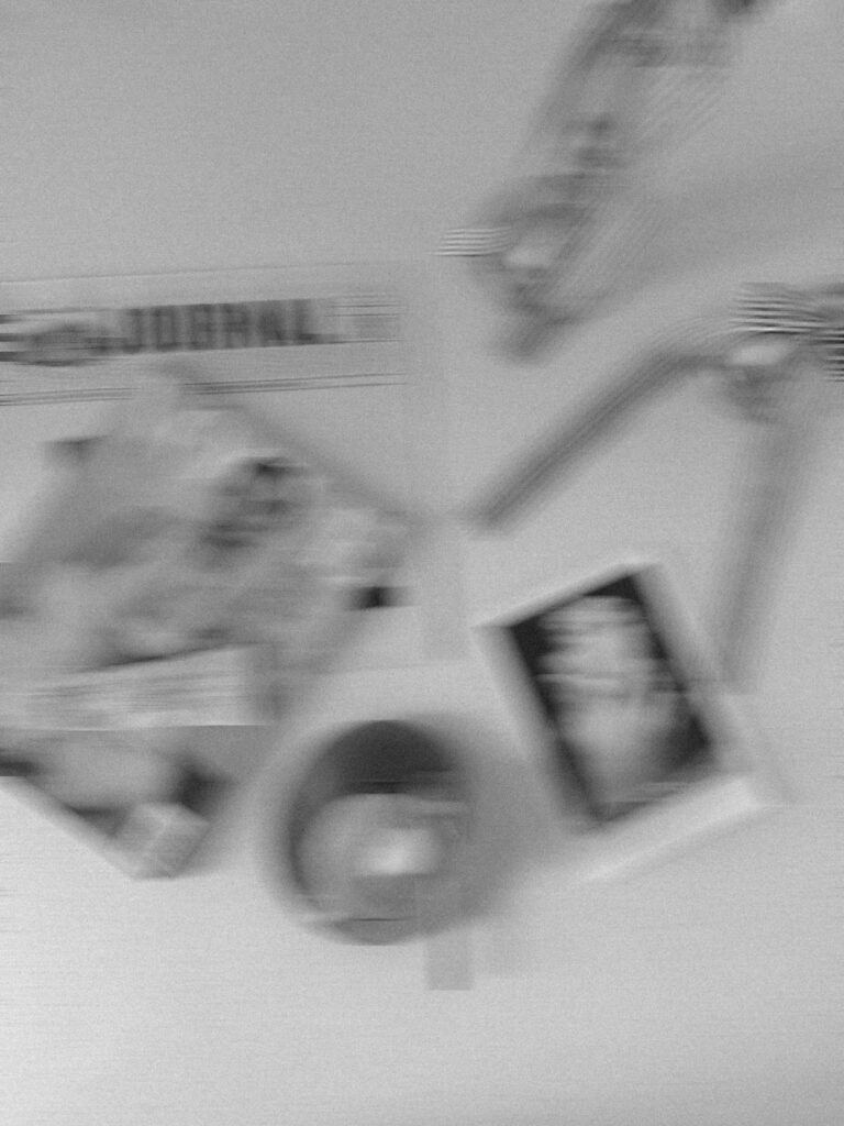 Black and white artistic photograph of blurred luxury items in motion